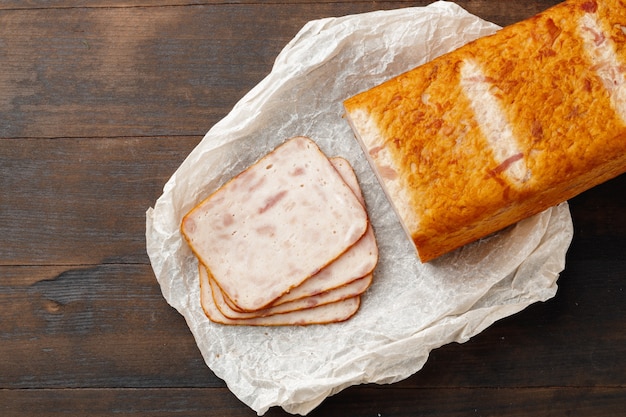 Cut chicken sausage slices on wooden table