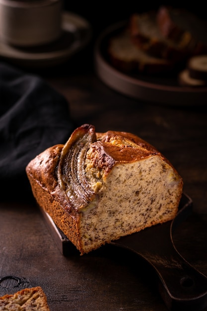 Cut freshly baked banana bread on a wooden board