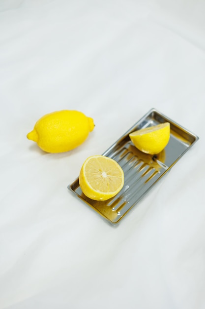 Cut lemon on a white background Sour yellow citrus fruit