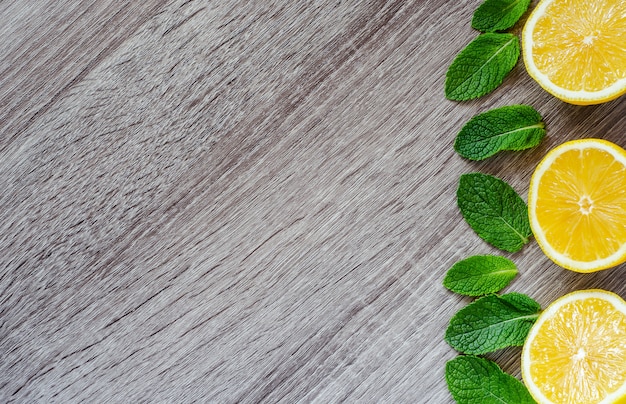 Cut lemons and mint leaves