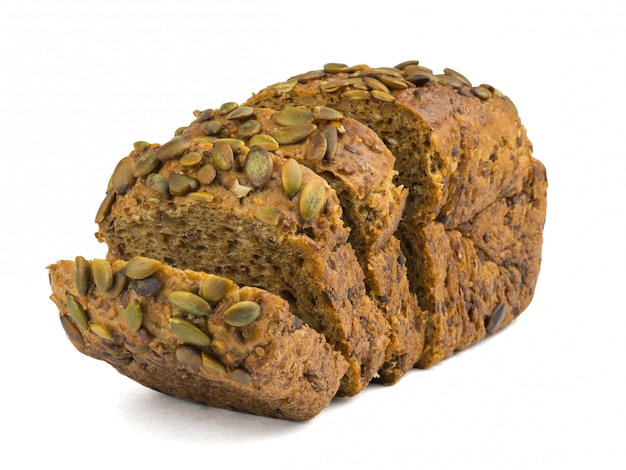 Cut a loaf of bread from wheat flour with pumpkin seeds and nuts isolated on white background