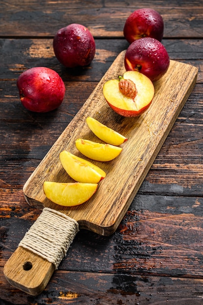 Cut nectarines on a wooden cutting Board