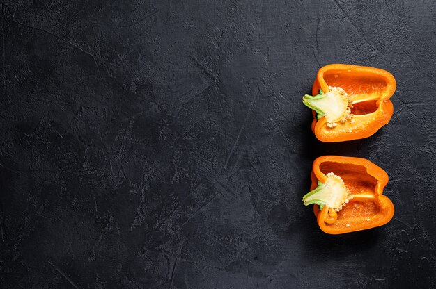 Cut orange bell pepper, two halves.