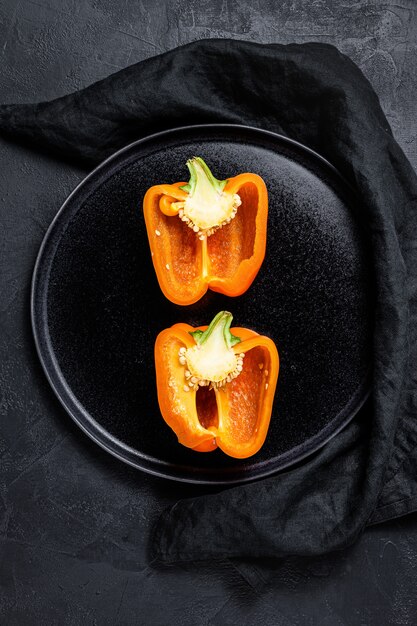 Cut orange sweet pepper, two halves.