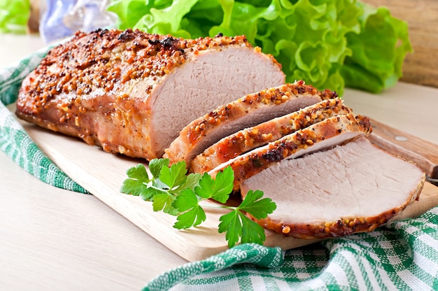 Cut pieces of baked meat on the table