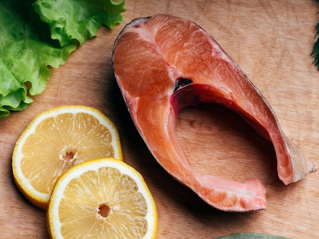 Cut pieces of red fish on Board, Fresh trout fillet