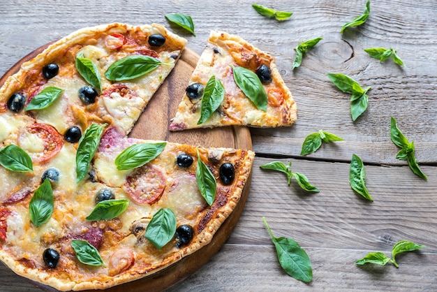 Cut pizza on the wooden board