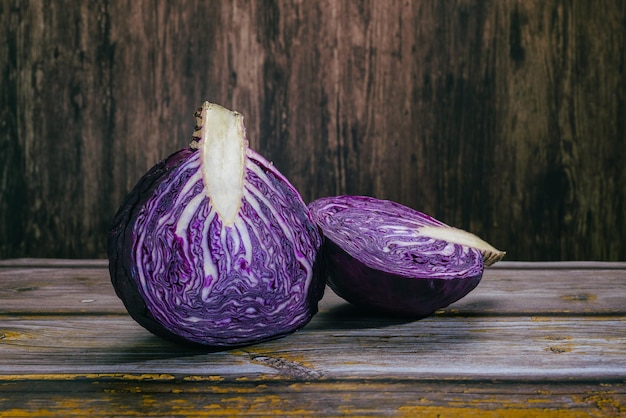 Cut purple cabbage on wooden table