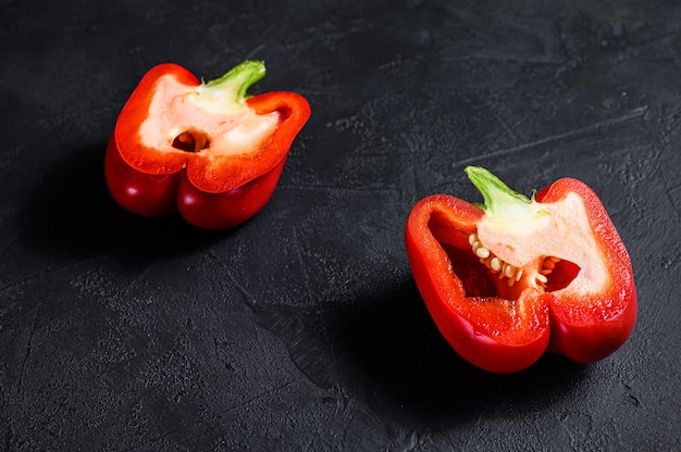 Cut red bell pepper, two halves. Top view.