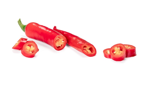 Cut red hot chili peppers Capsicum isolated on white background sliced red hot chili peppers highquality studio shot of red long capsicum top view