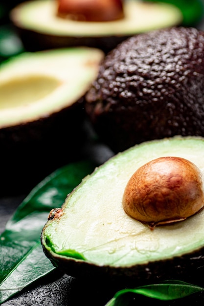 Cut ripe avocado with leaves