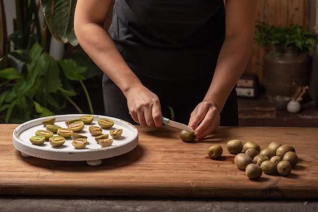 Cut ripe kiwi fruit on a wooden table