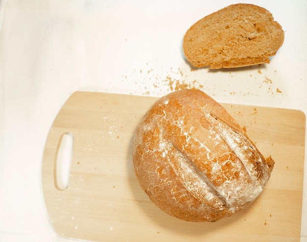 Cut rye bread lies on the board Fresh bakery