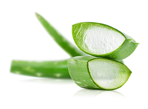 Cut slices of aloe on a white isolated background