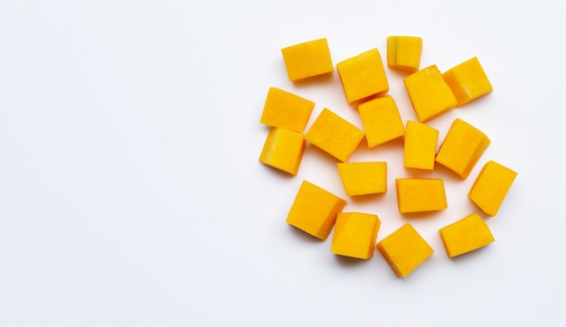 Cut and slices butternut squash on white background.