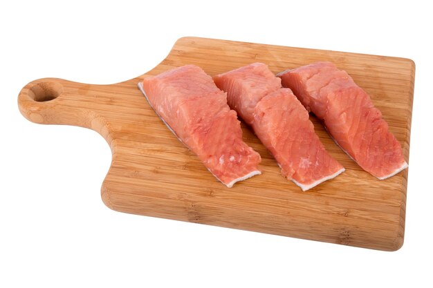 Cut slices of fish Siberian salmon on kitchen board isolated on white background