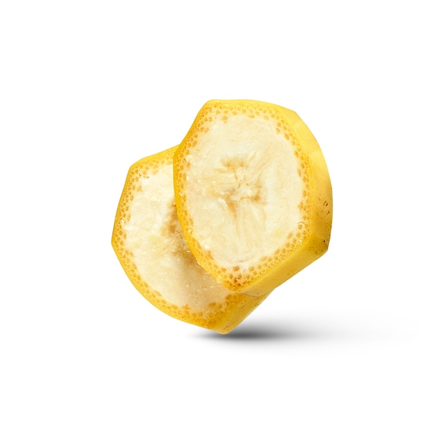 Cut slices of natural ripe fresh banana fruit isolated on a white wall