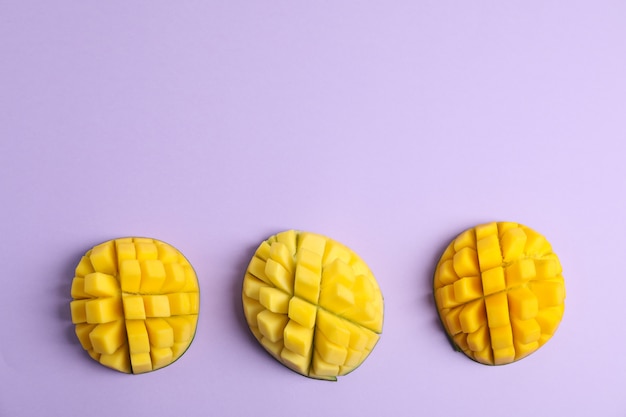 Cut tropical ripe mangoes, top view