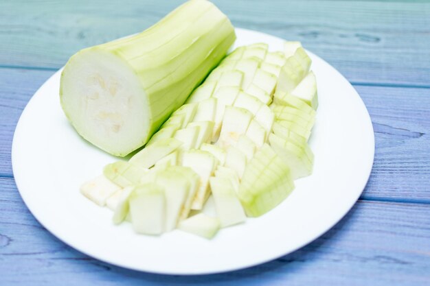 Cut zucchini on a white plate