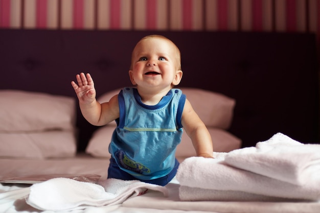 Cute 6 months newborn baby playing at home