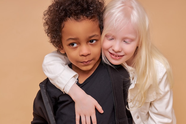 Cute adorable diverse children smiling together isolated