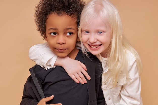 Cute adorable diverse children smiling together isolated