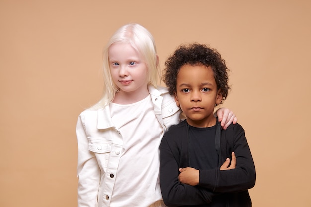 Cute adorable diverse children smiling together isolated