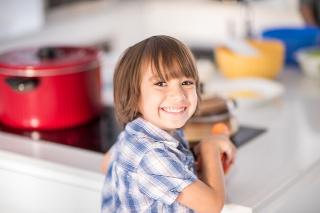 Cute adorable little boy in the kitchen