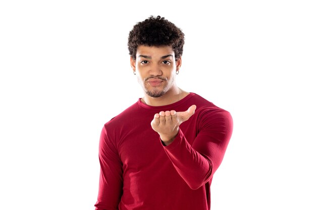 Cute african american man with afro hairstyle wearing a burgundy T-shirt isolated