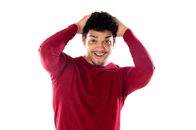 Cute african american man with afro hairstyle wearing a burgundy T-shirt isolated