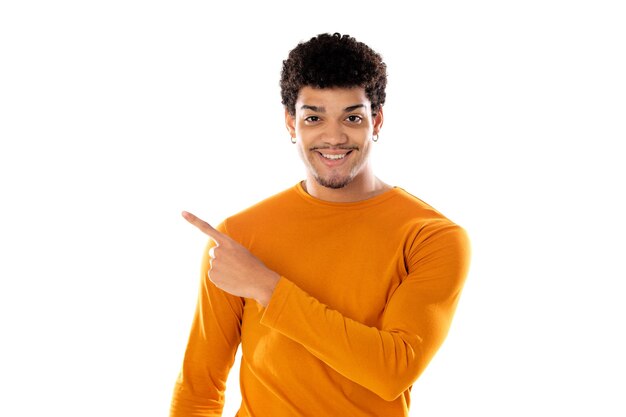 Cute african american man with afro hairstyle wearing a orange T-shirt isolated