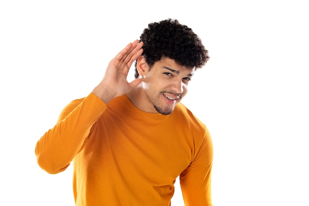 Cute african american man with afro hairstyle wearing a orange T-shirt isolated