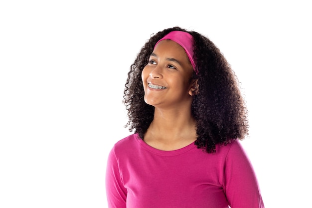 Cute African teenager wearing a pink headband isolated on a white background