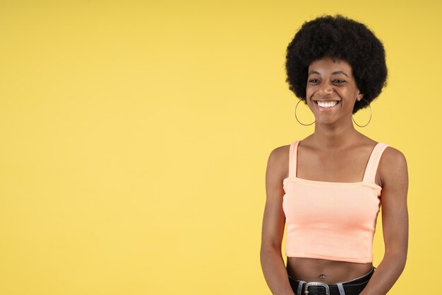 Cute afro woman laughing happily