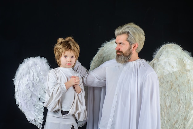 Cute angel valentines angels valentines day father and son angels little cupid boy gives father gift