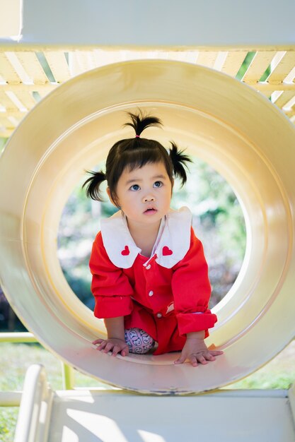 Cute asian baby playing at the playground