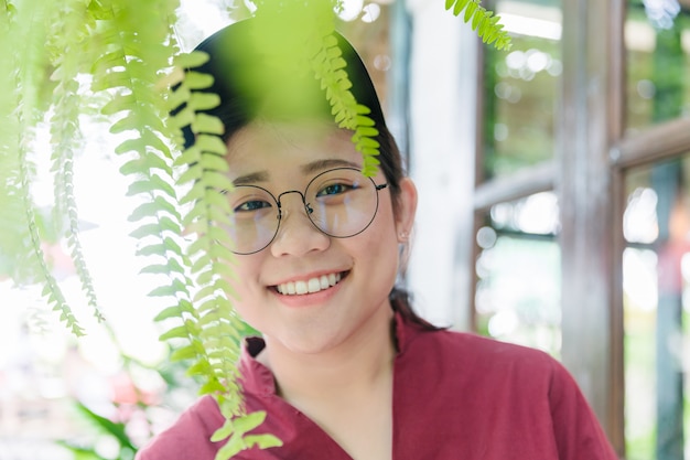 Cute Asian fat teen smile with glasses happy expression with good healthy white tooth