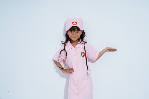 Cute asian little girl wearing a doctor uniform