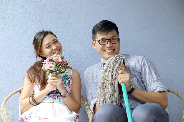 Cute Asian wedding photo shooting with antique blue color wall background