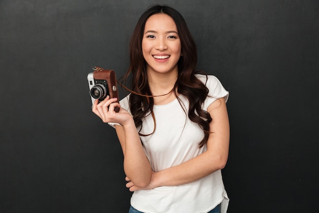 Cute asian young woman photographer