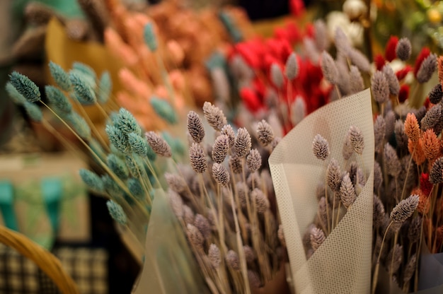 Cute autumn bouquets of colorful dried ears