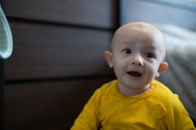 Cute baby boy close up playing at home, lifestyle