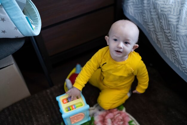 Cute baby boy close up playing at home, lifestyle