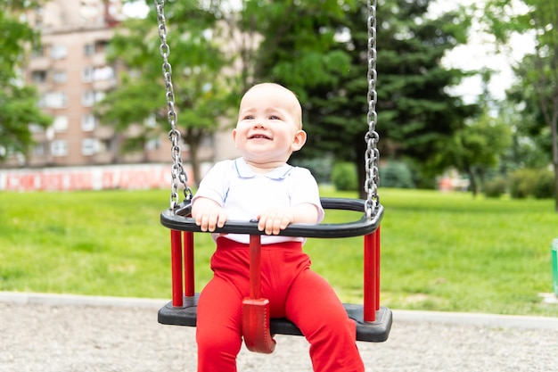 Cute Baby Boy Having Fun on a Swing