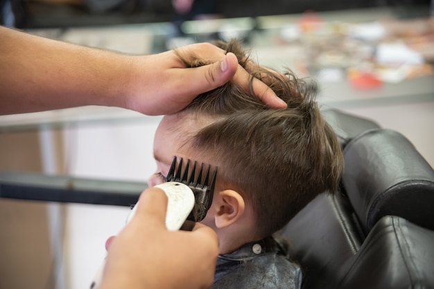 Cute baby boy toddler - cutting hair