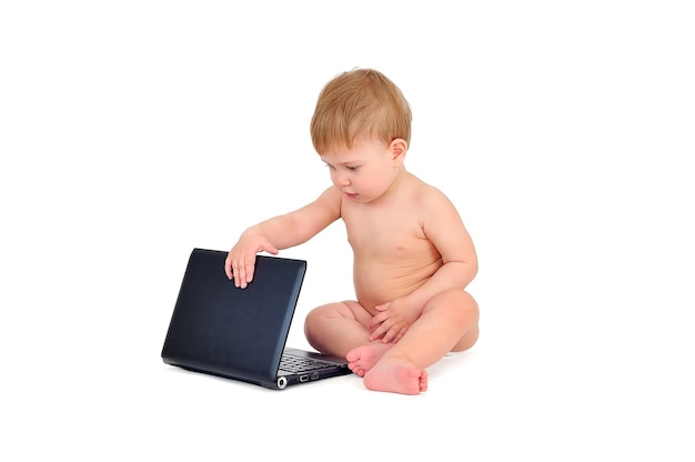 Cute baby boy on white background with laptop