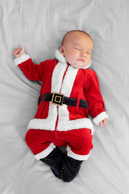 Cute baby dressed in santa claus clothing