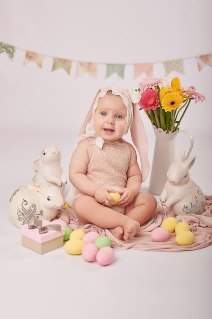 Cute baby in Easter composition