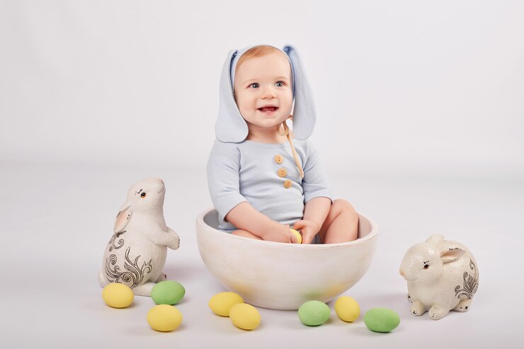 Cute baby in Easter composition