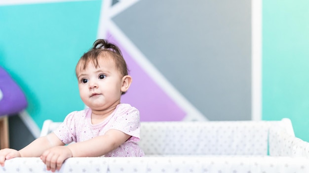 Cute baby girl in cradle